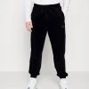 Karl Kani SMALL SIGNATURE PANTS UNISEX - Jogginghose - Black -Outlet KARL KANI Store 153d89fba10f44c3bb9872688e31a482