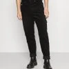 Karl Kani UNISEX RETRO PANTS - Stoffhose - Black 2 Karl Kani UNISEX RETRO PANTS - Stoffhose - Black -Outlet KARL KANI Store 24952fceb8104fc998afffec6652072e