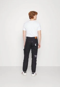 Karl Kani RETRO RINSED PANTS UNISEX - Jeans Relaxed Fit - Black -Outlet KARL KANI Store 2e4e7ddf3b7b431aa21e2e0b0a41d42b