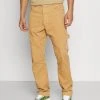 Karl Kani RETRO PANTS UNISEX - Stoffhose - Sand 2 Karl Kani RETRO PANTS UNISEX - Stoffhose - Sand -Outlet KARL KANI Store 308a22134f674cf896d72aafcc61191d