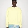 Karl Kani SMALL SIGNATURE WASHED CREW UNISEX - Sweatshirt - Light Yellow 2 Karl Kani SMALL SIGNATURE WASHED CREW UNISEX - Sweatshirt - Light Yellow -Outlet KARL KANI Store 3703594047874a448410b8d21a0dc547