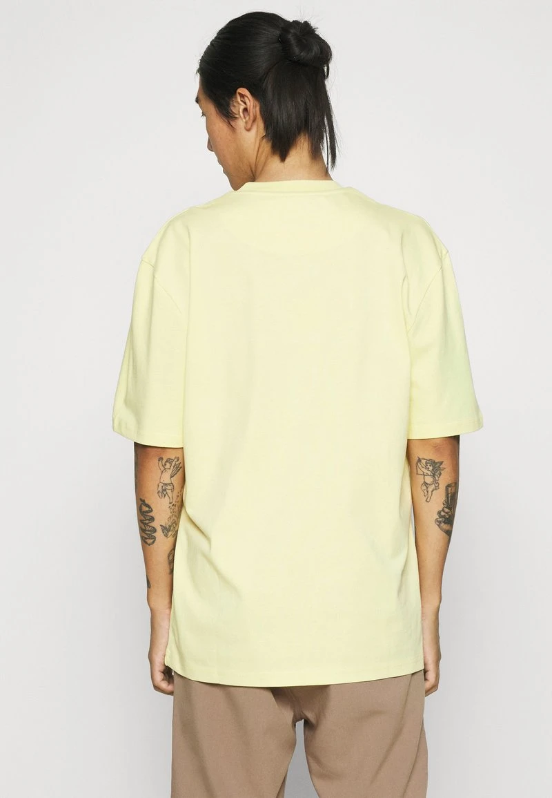UNISEX SMALL SIGNATURE TEE - T-Shirt print - light yellow Karl Kani UNISEX SMALL SIGNATURE TEE - T-Shirt Print - Light Yellow -Outlet KARL KANI Store 39177e192ae4402fb5d49ccfa199bf42