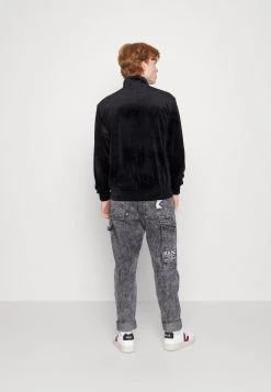 Karl Kani SMALL SIGNATURE JACKET UNISEX - Leichte Jacke - Black -Outlet KARL KANI Store 46746ae635694f5888cbbd775b8d8fc4