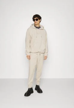 Karl Kani SIGNATURE UNISEX - Jogginghose - Light Sand -Outlet KARL KANI Store 4dea51292de4494bae5105bd0b413c5f