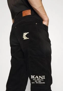 Karl Kani UNISEX RETRO PANTS - Stoffhose - Black 6 Karl Kani UNISEX RETRO PANTS - Stoffhose - Black -Outlet KARL KANI Store 52023d2588474dafb336d62155c1306f