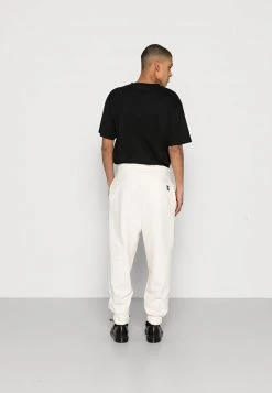 Karl Kani SMALL SIGNATURE UNISEX - Jogginghose - Cream -Outlet KARL KANI Store 6107abc0a7fc4bb19671da6e0cf23ec5