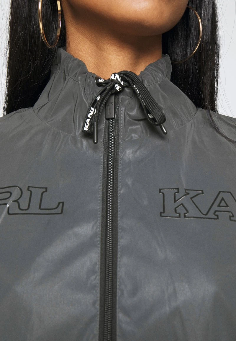 RETRO REFLECTIVE TRACKJACKET - Leichte Jacke - black Karl Kani RETRO REFLECTIVE TRACKJACKET - Leichte Jacke - Black, Damen -Outlet KARL KANI Store 6f308b1c0b4c48bface34c2b386a5caf