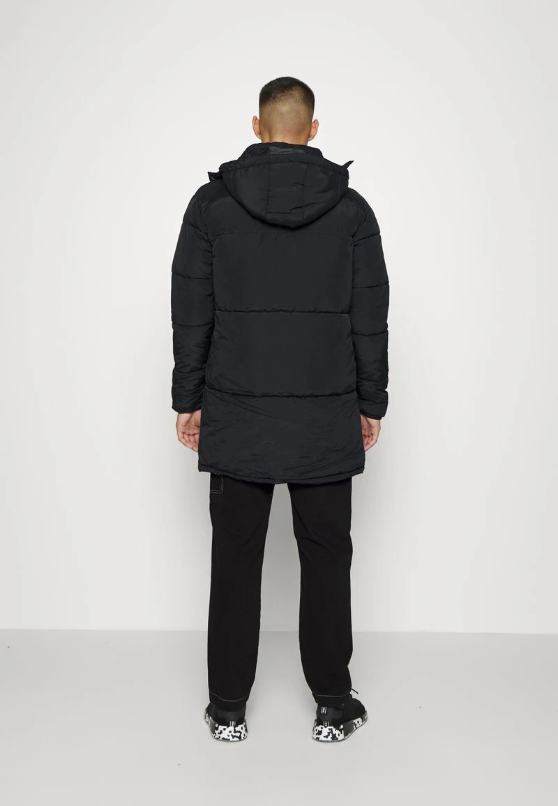 Karl Kani LONG HOODED PUFFER JACKET UNISEX - Wintermantel - Black 5 Karl Kani LONG HOODED PUFFER JACKET UNISEX - Wintermantel - Black – Bild 3