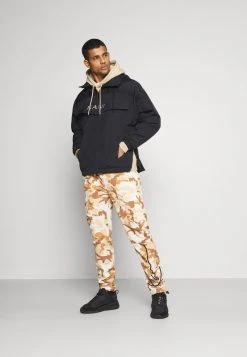 Karl Kani SIGNATURE CAMO CRINCLE PANTS - Cargohose - Beige/sand, Herren -Outlet KARL KANI Store 75f44160cb2f4cccafdd30b70b8e834e
