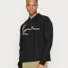 Karl Kani UNISEX SIGNATURE - Sweatjacke - Black 2 Karl Kani UNISEX SIGNATURE - Sweatjacke - Black -Outlet KARL KANI Store 79633cffaa1c4fd9a8664383cafc49f7