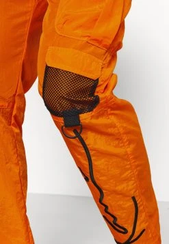 Karl Kani SIGNATURE CRINCLE PANTS UNISEX - Cargohose - Orange 5 Karl Kani SIGNATURE CRINCLE PANTS UNISEX - Cargohose - Orange -Outlet KARL KANI Store 7a99ca0439184026a0d949411495245c