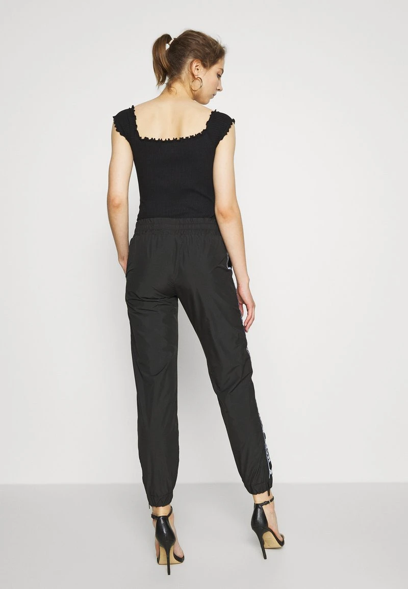 TRACKPANTS - Jogginghose - black Karl Kani TRACKPANTS - Jogginghose - Black, Damen -Outlet KARL KANI Store a1dfdc85c36b47eb8718dd7c6c955b0f