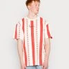 Karl Kani SMALL SIGNATURE STRIPE TEE UNISEX - T-Shirt Print - Red