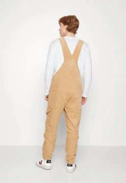 Karl Kani RETRO DUNGAREE UNISEX - Stoffhose - Sand 10 Karl Kani RETRO DUNGAREE UNISEX - Stoffhose - Sand -Outlet KARL KANI Store b666d31a7ca34fda942547b3377e662a
