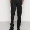 Karl Kani SMALL SIGNATURE TRACKPANTS - Jogginghose - Black, Herren -Outlet KARL KANI Store bca54631c8f343c998a56de752678e14