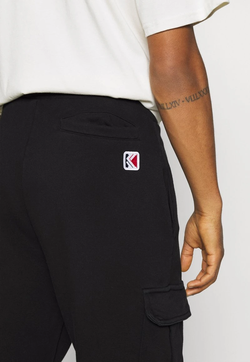 SMALL SIGNATURE BLEACHED UNISEX - Jogginghose - black Karl Kani SMALL SIGNATURE BLEACHED UNISEX - Jogginghose - Black -Outlet KARL KANI Store c953382736df412d8f4678aa045bc3a2
