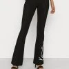 Karl Kani SIGNATURE CUT OUT - Stoffhose - Black, Damen 1 Karl Kani SIGNATURE CUT OUT - Stoffhose - Black, Damen -Outlet KARL KANI Store cb07435a018a40fdb301d83653b4f542