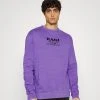 Karl Kani UNISEXRETRO WASHED CREW - Sweatshirt - Lilac 1 Karl Kani UNISEXRETRO WASHED CREW - Sweatshirt - Lilac -Outlet KARL KANI Store cfc512ca13794306acdc9fcaade16b12