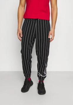 Karl Kani SIGNATURE PINSTRIPE PANTS UNISEX - Jogginghose - Black