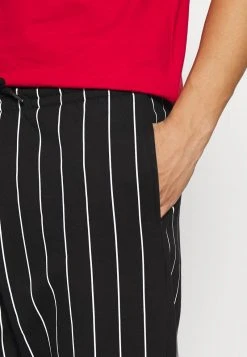 Karl Kani SIGNATURE PINSTRIPE PANTS UNISEX - Jogginghose - Black -Outlet KARL KANI Store d6ac38f331b240a09e0c463f584878eb