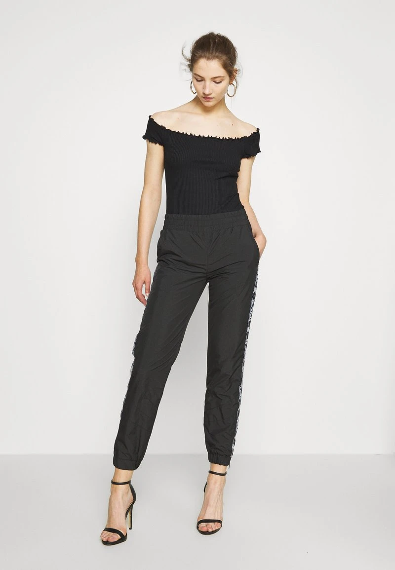 TRACKPANTS - Jogginghose - black Karl Kani TRACKPANTS - Jogginghose - Black, Damen -Outlet KARL KANI Store db2377e3687c4776ae703dbff899b32f