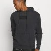 Karl Kani UNISEX HOODIE - Sweatshirt - Black -Outlet KARL KANI Store f5beea56e8f54a248edfab8bf93264ca