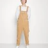 Karl Kani RETRO DUNGAREE UNISEX - Stoffhose - Sand 1 Karl Kani RETRO DUNGAREE UNISEX - Stoffhose - Sand -Outlet KARL KANI Store f68fcfdc67c543d98f93380af0cffa4e