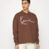 Karl Kani SIGNATURE TROYER UNISEX - Sweatshirt - Brown -Outlet KARL KANI Store fc955cc141544a2e86696adb900de5dc