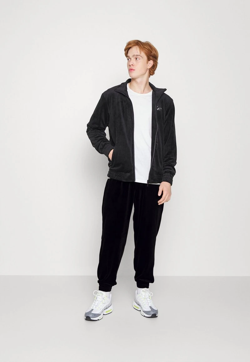 Karl Kani SMALL SIGNATURE PANTS UNISEX - Jogginghose - Black 4 Karl Kani SMALL SIGNATURE PANTS UNISEX - Jogginghose - Black – Bild 2